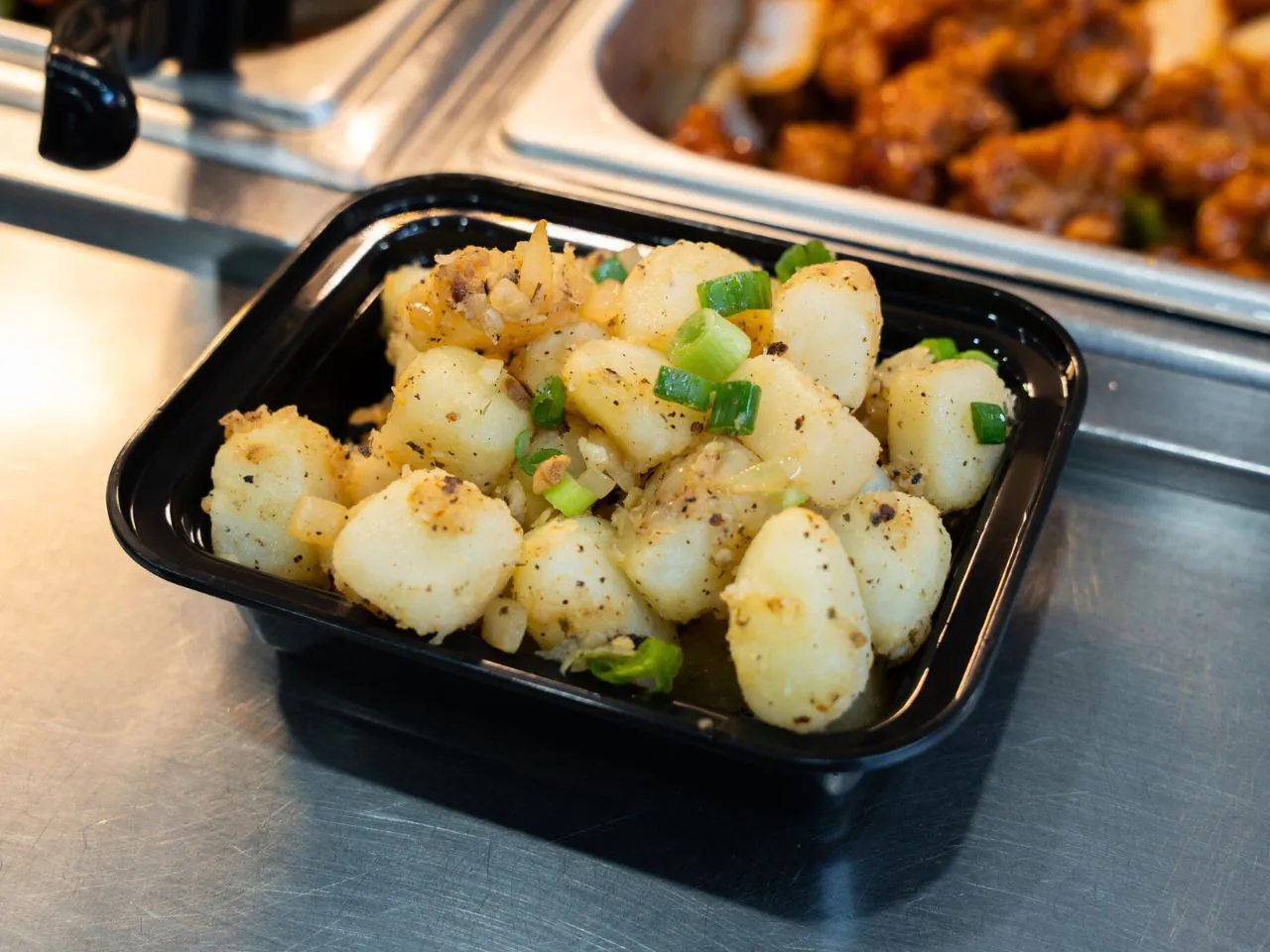 Pan-seared scallops with salt, pepper and scallions at Kennys Wok, a Chinese Restaurant in Philadelphia