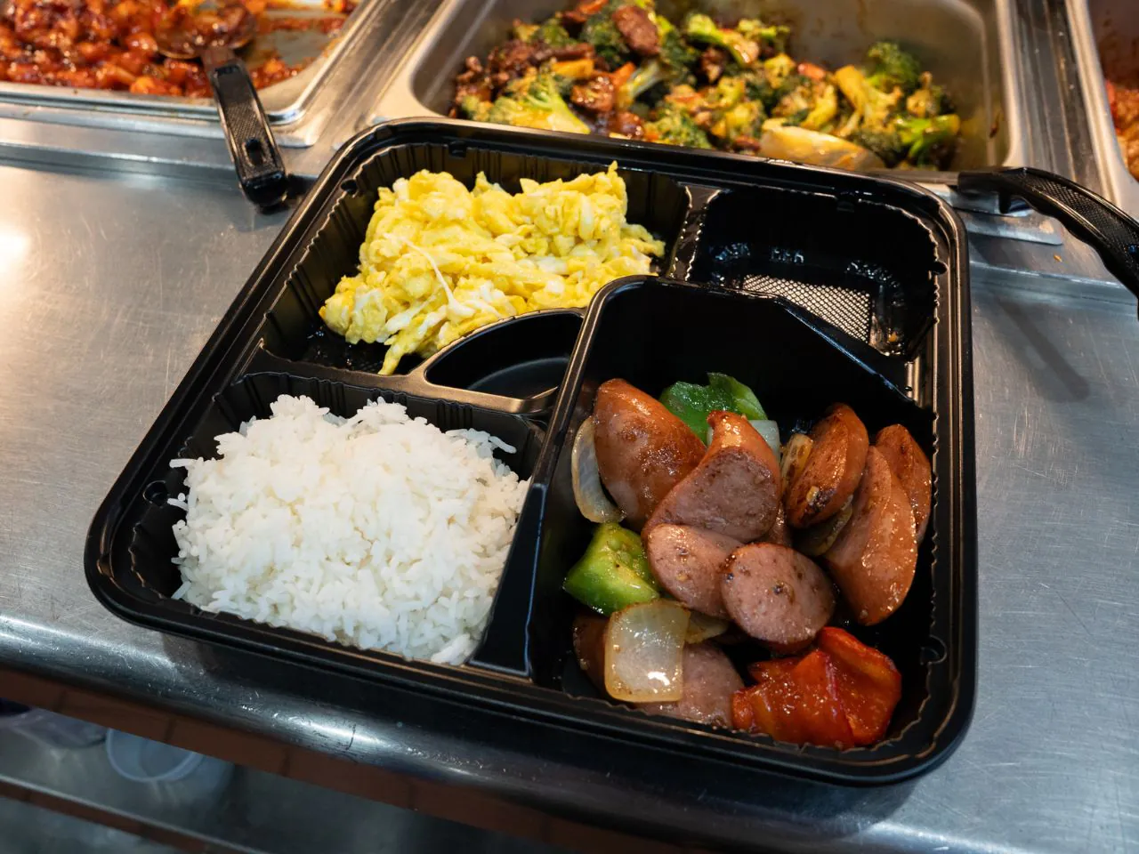 Breakfast plate with sausage, scrambled eggs and rice at Kennys Wok, a Chinese Restaurant in Philadelphia