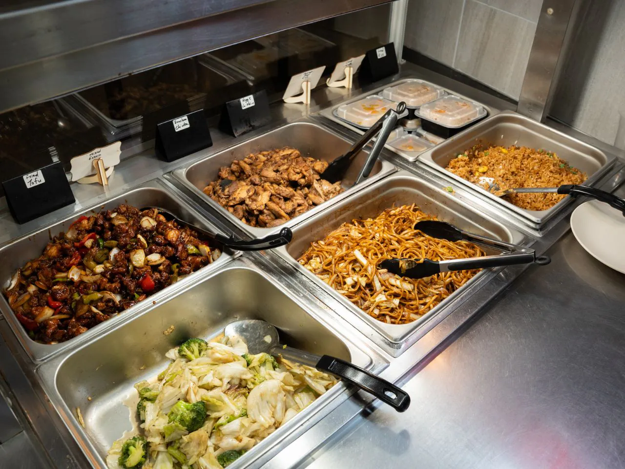 Assorted buffet dishes including kung pao chicken and chow mein at Kennys Wok, a Chinese Restaurant in Philadelphia
